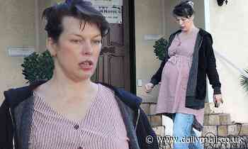 Milla Jovovich dresses baby bump in a red striped maternity dress while out in Los Angeles