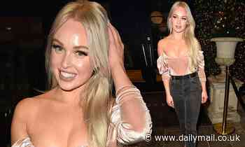 Jorgie Porter puts on a busty display as she flaunts her cleavage in a baby pink corset-style top