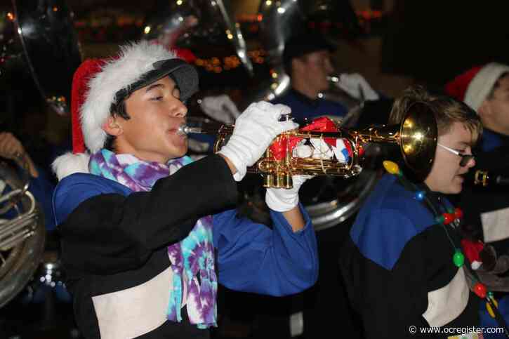 Photos: Amid some showers, Seal Beach celebrates annual Christmas Parade with movie theme