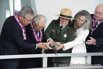 U.S. and Japanese officials pour whiskey from wartime canteen in show of reconciliation