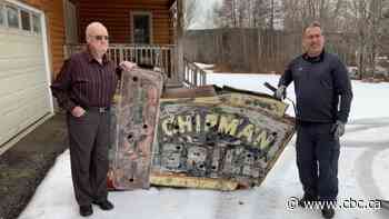 Treasure hunter finds Chipman's first neon sign buried in snow in woods