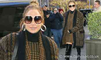 Jennifer Lopez struts her style in snakeskin boots and arrives at SNL in New York ahead of hosting