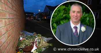 Flowers mark the spot where bus driver David Cameron died as community reels from shock killing