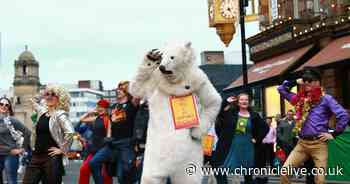 A dancing polar bear, disco moves and many wigs: Watch Extinction Rebellion's groovy dance protest