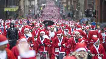 In Pictures: Dashing through the streets as Santas run for charity
