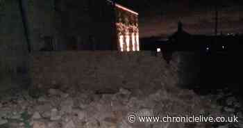 Car crashes into stone wall and flips onto roof after coming off Military Road in Northumberland