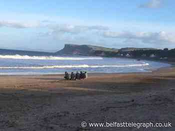 Family and friends of Deirdre McShane gather on Ballycastle beach following tragic death