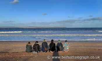 Friends of Deirdre McShane gather on Ballycastle beach following tragic death