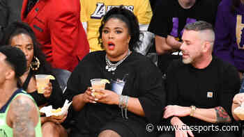 Lizzo shoots her shot with Karl-Anthony Towns while sitting courtside at Timberwolves-Lakers game