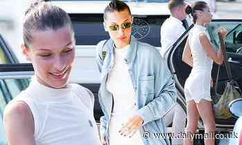 Bella Hadid leaves VERY little to the imagination as she flashes her cleavage