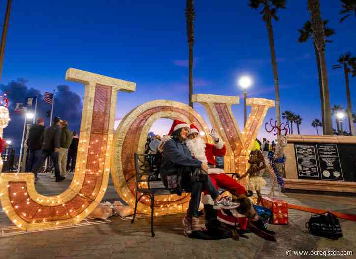 Giant snowflakes come aglow for the holidays at Huntington Beach Pier