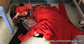 The truth behind claims photo of a boy lying on a hospital floor was staged by his mother