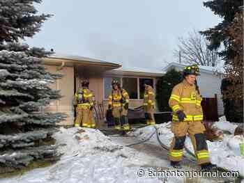 Two safely evacuated as fire crews battle 'stubborn' house fire in west Edmonton