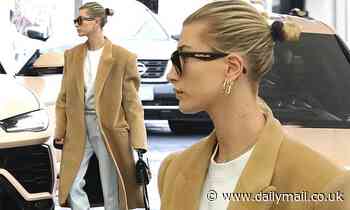 Hailey Bieber rocks her favorite comfy combo of taupe men's style coat and lounge outfit 