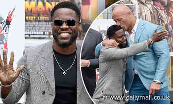 Kevin Hart gets a big kiss from co-star Dwayne 'The Rock' Johnson during hand and footprint ceremony
