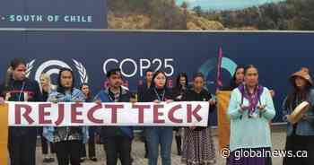 Indigenous activists protest proposal of massive oilsands mine at COP25 in Madrid