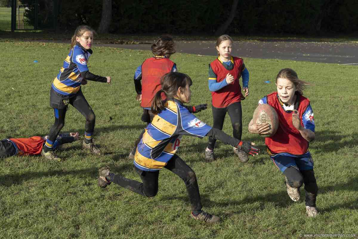 Merton students rub shoulders with England stars during rugby workshop