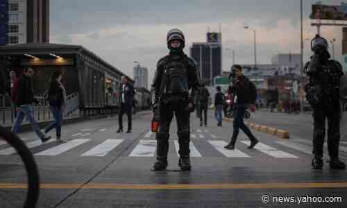 Outrage after Colombia riot police force young woman into unmarked car