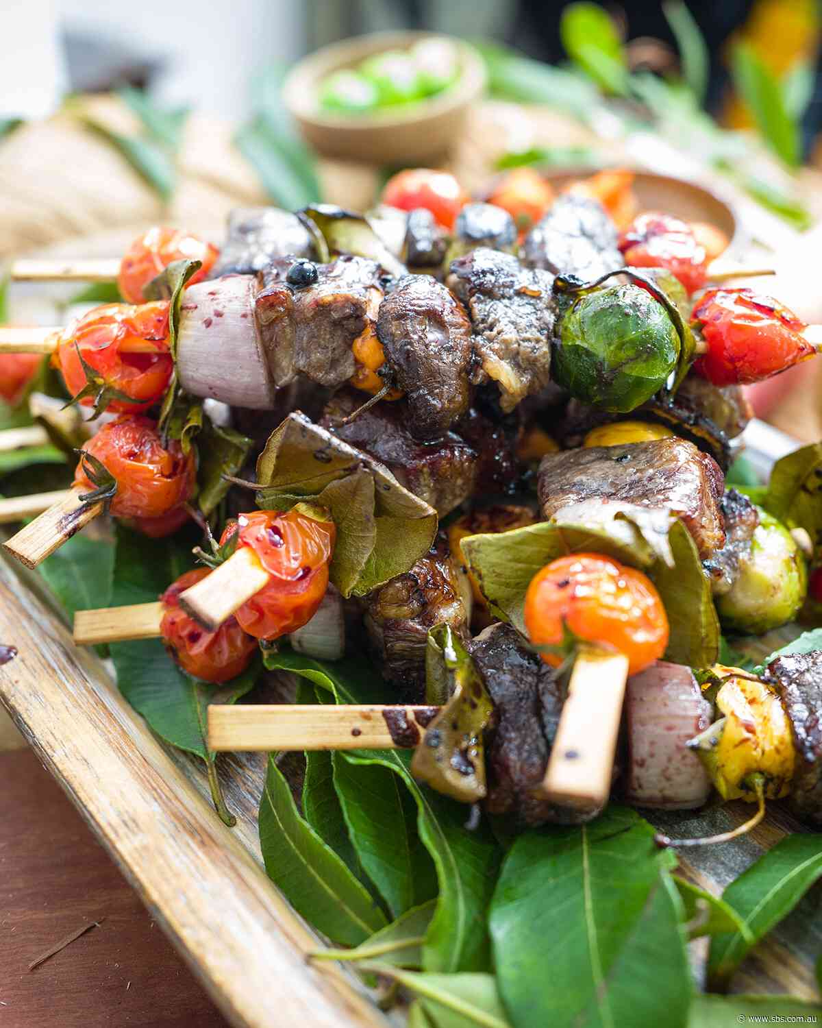 Grilled beef skewers with pepperberry sauce
