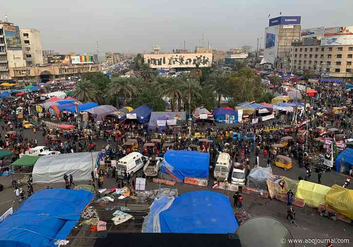 Baghdad mob kills teen gunman and strings up his corpse