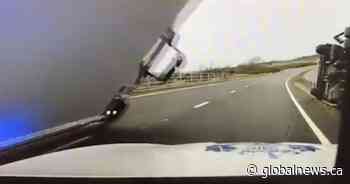 Scottish police officer has close call after truck falls on cop car