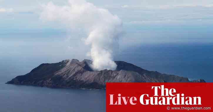 New Zealand volcano eruption: dive teams to search for two bodies off White Island – live