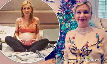 Pregnant Rachel Riley cradles her growing baby bump as she celebrates Christmas Jumper Day