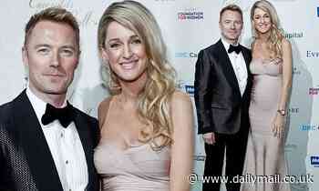 Ronan Keating's pregnant wife Storm shows off her blossoming baby bump in a pink gown