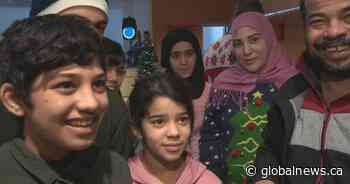 Recent immigrants in Edmonton take part in their first Canadian Christmas celebration