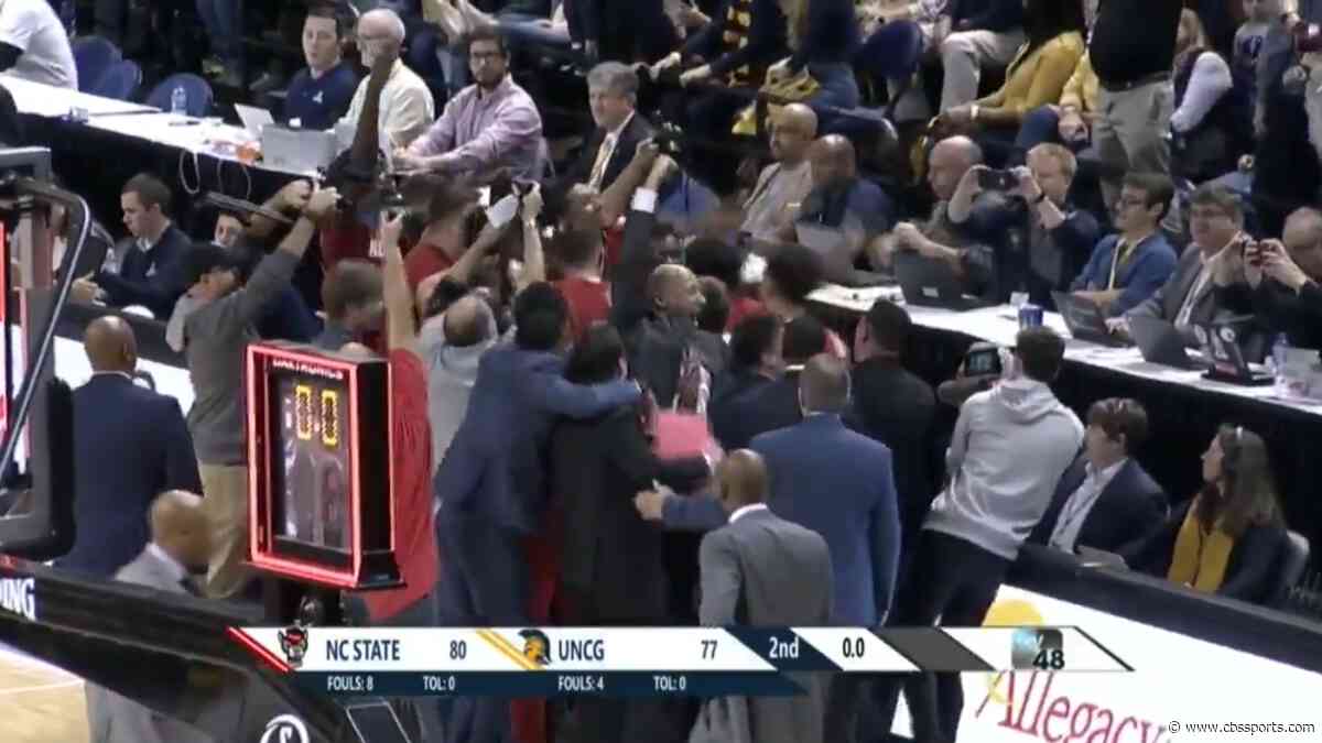 WATCH: NC State knocks off UNC Greensboro with dramatic halfcourt heave at the buzzer