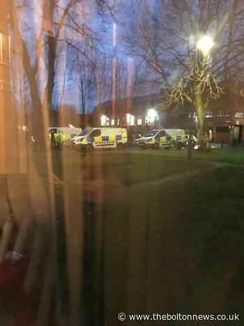 Police tape off Farnworth street after man's body found