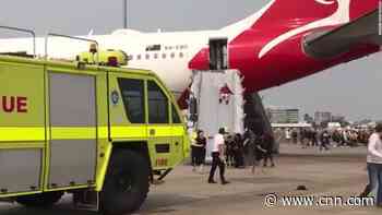 Flight turns back after cabin fills with smoke