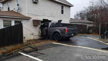 Woman lying in bed killed when pickup truck slams into her home