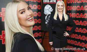 Erika Jayne is dressed to kill as she models short black tuxedo dress to Chicago photo call
