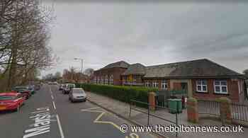 Crash outside Farnworth primary school leaves man with head injuries