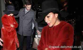 Nicole Scherzinger's rumoured beau Thom Evans wraps a protective arm around her