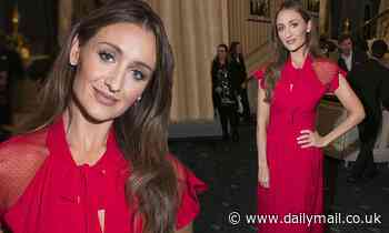 Catherine Tyldesley dazzles in a scarlet semi sheer gown as she enjoys a night at the theatre