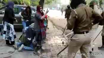 Police were going to beat student. See woman's act that went viral.