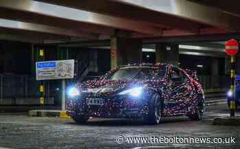 Man wraps car in Christmas lights to cheer people up