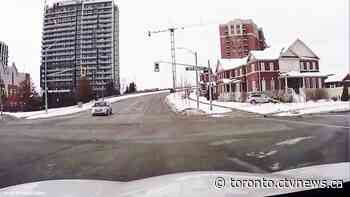 Video captures moment vehicle speeds through intersection and crashes into pole