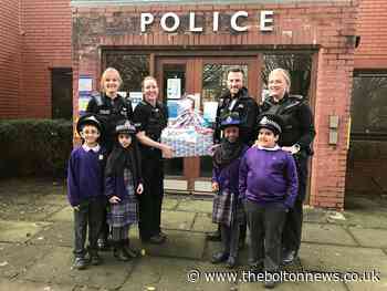 Astley Bridge police officers get goodies from Olive School pupils