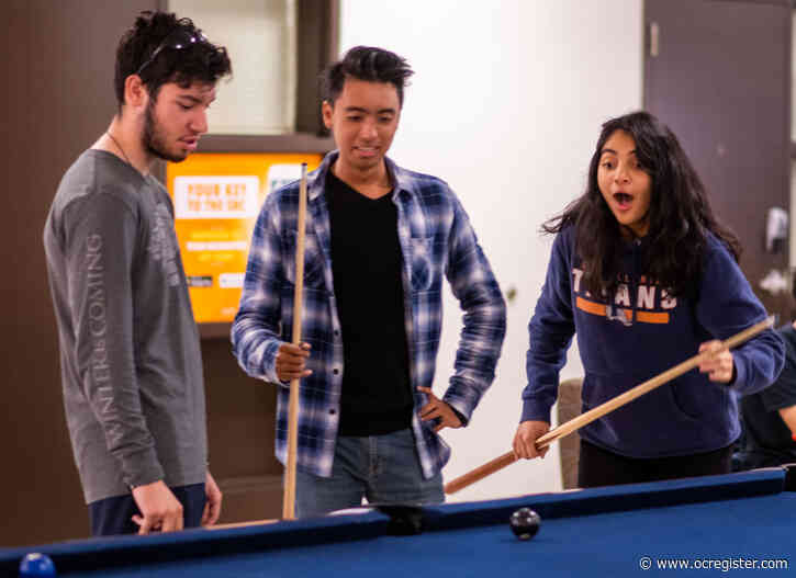 Photos: CSUF students gather for bowling, billiards, silent disco to gear up for finals week
