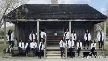 Medical students pose in front of Louisiana plantation's slave quarters for powerful photo