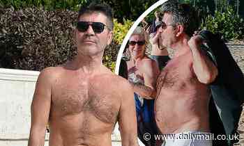 Topless Simon Cowell shows off torso and son Eric on beach