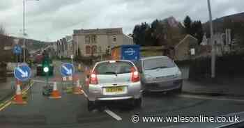 Driver filmed ploughing through traffic light-controlled roadworks as lorry came other way