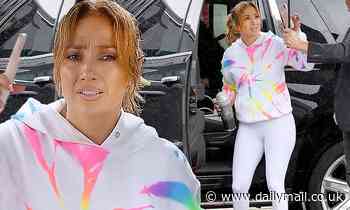 Jennifer Lopez rocks an electric tie-dye sweatshirt as she battles the rain before the gym in Miami