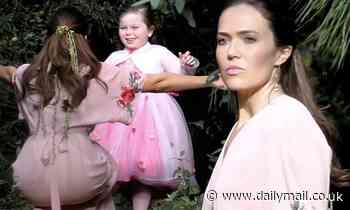 Mandy Moore looks ethereal in a billowing pink gown as she films her hit series This Is Us in LA