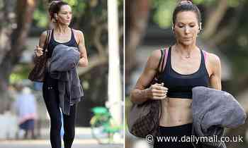 Kyly Clarke reveals her slender and ripped figure a crop top and leggings after working out
