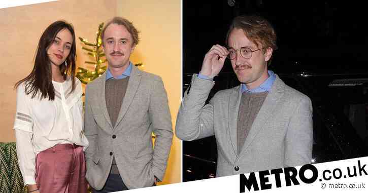 Tom Felton and his fabulous facial hair enjoy festive night out after reuniting with Harry Potter cast