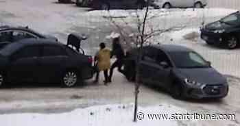 Thieves caught on video robbing woman in St. Paul, dragging her with car